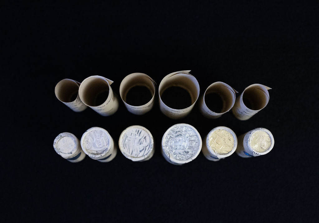 Rolling paper before and after rolled coins